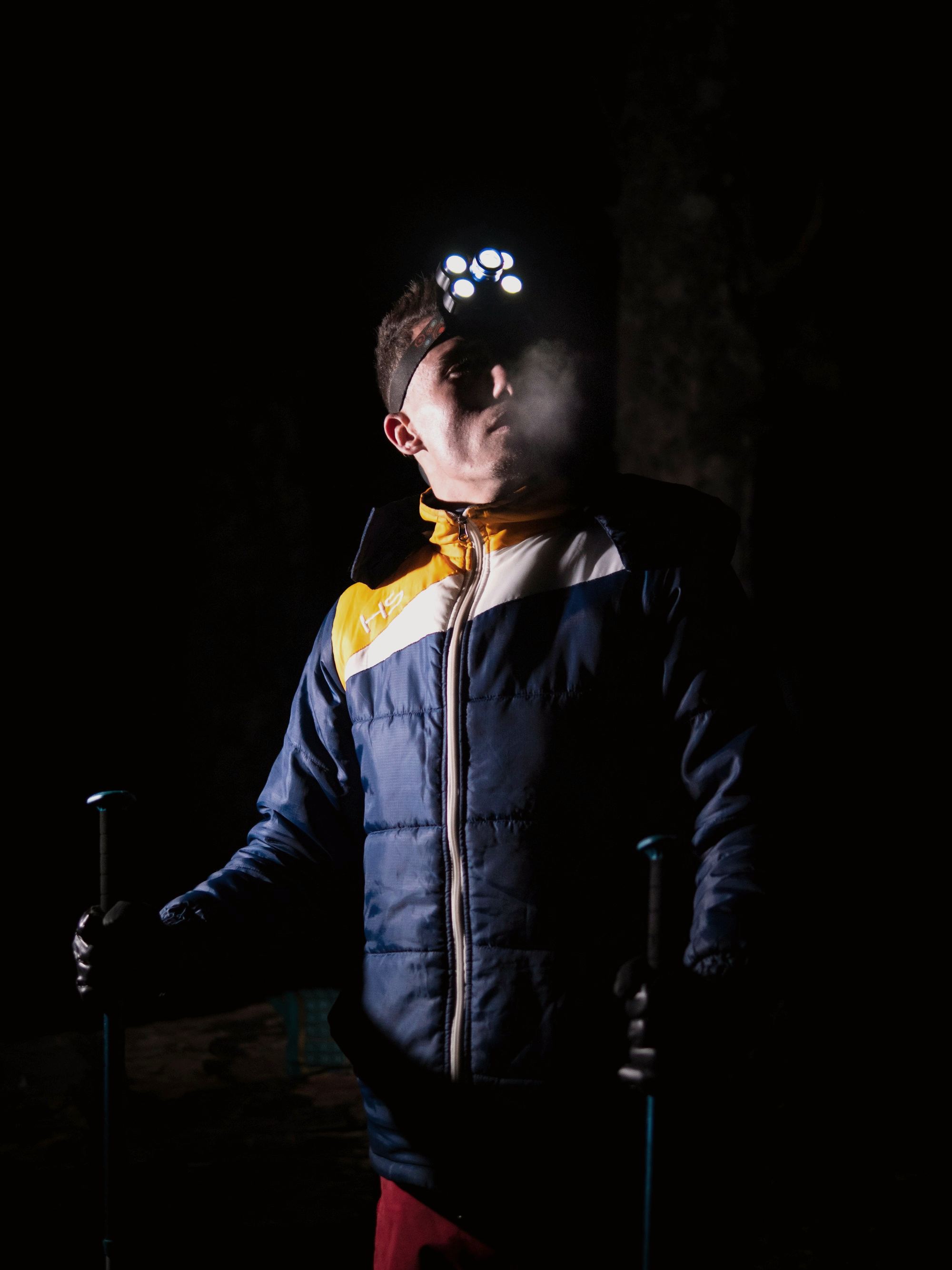 A miner in darkness with a headlamp